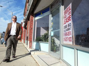 Windsor Ward 4 candidate Chris Holt by a vacant storefront in the 1600 block of Tecumseh Road East on Oct. 9, 2014. (Dan Janisse / The Windsor Star)