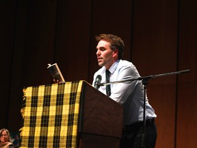 Alexander MacLeod, one of Alistair MacLeod's sons reads during BookFest Windsor's Tribute to Alistair MacLeod on Saturday, October 25, 2014 at the Capitol Theatre. (JAY RANKIN/The Windsor Star)