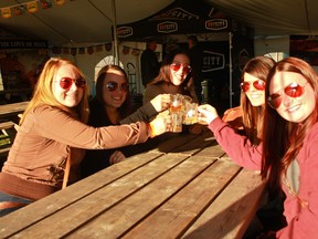 Cheers! From left, Haley Minshall, Michelle Paton, Sarah Smith , Leigha Bevins and Alexis Lemay cheers at LaSalle's first beer festival on Oct. 11, 2014 at the Vollmer Recreation Complex. (JAY RANKIN/The Windsor Star)