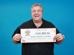 Poker Lotto winner Joseph Campanaro of Windsor with his cheque from the Ontario Lottery and Gaming Corporation on Oct. 30, 2014. (Handout / The Windsor Star)