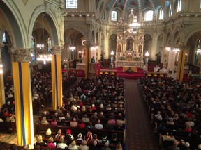 In this photo taken on Oct. 12, 2014, Detroit Archbishop Allen Vigneron delivers his homily during Mass at St. Francis D’Assisi Church in Detroit on Oct. 12, 2014. (AP Photo/Mike Householder)