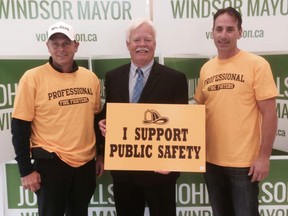 Windsor Professional Firefighters Association members with mayoral candidate John Millson (centre) at his campaign office on Oct. 4, 2014. (Handout / The Windsor Star)