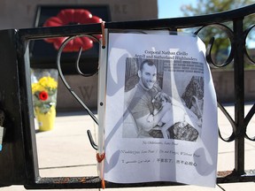 Flowers and tributes to Cpl. Nathan Cirillo are shown at the downtown Windsor, ON. cenotaph on Thursday, Oct. 23, 2014. (DAN JANISSE/The Windsor Star)