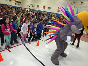 Pachi the Porcupine, the Toronto 2015 Pan Am Games mascot, visits Dougall Avenue Public School for the games' Torch Relay presentation, Monday, Oct. 6, 2014.  (DAX MELMER/The Windsor Star)