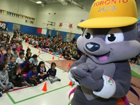 Pachi the Porcupine, the Toronto 2015 Pan Am Games mascot, visits Dougall Avenue Public School for the games' Torch Relay presentation, Monday, Oct. 6, 2014.   (DAX MELMER/The Windsor Star)