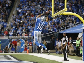 Detroit Lions wide receiver Corey Fuller catches the game tying touchdown during the second half against the New Orleans Saints in Detroit, Sunday, Oct. 19, 2014. (AP Photo/Paul Sancya)