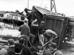 Four days before Christmas, 1966, a truck collided with a school bus at Walker Rd. and Highway 3.  The truck overturned and spilled tons of sand into the bus.  Despite the efforts of rescue workers, eight children died under the crushing weight.  (Windsor Star File Photo)