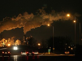 In this file photo, cars travel along E.C. Row west near Matchette Rd. as the Zug Island towers glow in the background. (The Windsor Star-Dan Janisse)