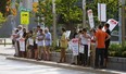 Windsor University Faculty Association (WUFA) members protest on the University of Windsor campus in this August 2014 file photo. (Tyler Brownbridge / The Windsor Star)