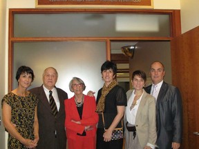Family members of Dr. George Yee stand in front of the chemotherapy suite which now bears his name. Left to right are: Dr. Lauren Yee (daughter), William Yee (brother), Fay Yee (wife), Leslie Yee (daughter), Jennifer Yee (daughter) and Albert Schumacher (son-in-law). (Photo courtesy of the Windsor Essex County Cancer Centre Foundation)