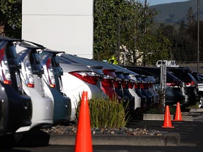 The Motor Vehicle Dealers Act requires that the price include all  fees and charges, except HST and licensing. (Justin Sullivan / Getty Images)