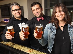 Organizers of the upcoming Windsor Craft Beer Festival raise a glass at Brew micro-brewery in Windsor: Gino Gesuale, left, Adriano Ciotoli and Pina Ciotoli. (DAN JANISSE / The Windsor Star)