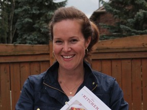 Author Moira Sanders and her new cookbook, The Kitchen Table Cookbook.