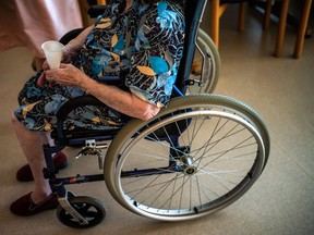 A number of people who suffer from osteoporosis end up in a wheelchair. (JEFF PACHOUD / AFP / Getty Images files)