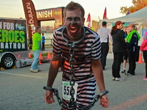 Kyle Uszynski turns full-out zombie for the Zombie Chase Windsor 2014 on October 11. The run saw more than 400 participants run or walk five kilometres on Windsor's Riverfront Trail. (JAY RANKIN/The Windsor Star)