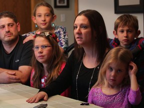 Julie Teti, centre, mother of four children, discusses how she is dealing with mesothelioma, a rare form of cancer Monday November 3, 2014. Husband Domenic Teti, left, children Josie, 12, Allisyn, 5, Madeleine, 10, behind left, Domenico, 8, will be participating with friends and family in a fundraising dinner at Giovanni Caboto Club November 9, 2014.  See Thompson story. (NICK BRANCACCIO/The Windsor Star)