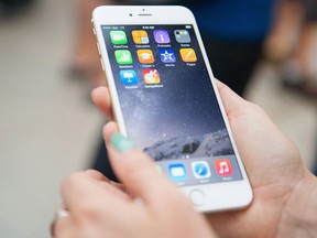 The new iPhone 6 was released at the Eaton Centre in Toronto, Ont. on Friday, Sept. 19, 2014. Thousands of people waited in line to get the new iPhone 6. THE CANADIAN PRESS/Hannah Yoon