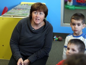 Theresa Shepley, left, cares for children at Serendipity Childcare Centre on Malden Road Monday November 10,  2014.  (NICK BRANCACCIO/The Windsor Star)