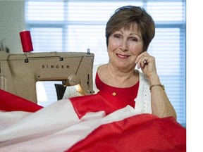 Joan O'Malley, in her Ottawa home Tuesday November 4, 2014, stitched together the first mockups of the Canada's Maple Leaf flag 50 years ago. (Darren Brown/Postmedia News)