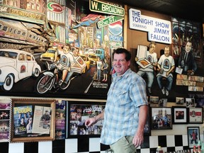 Martin Hayes in front of his artwork at Nat’s Pizza in Vancouver. The chalk artist found that his Sunday blues lifted when he decided to become self employed.