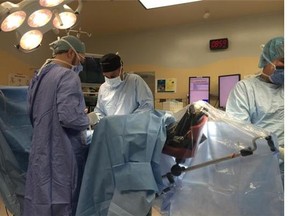 Doctors begin a prostate surgery on "Mr. P" at Toronto East General Hospital. The procedure was live-tweeted Thursday.
(Toronto East General Hospital via Twitter)
