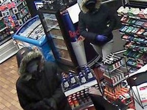 Images of a man and a woman robbing Fay Mart Convenience in the 3300 block of Howard Avenue were released by Windsor Police.