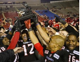 Calgary Stampeders celebrate winning the CFL Western Final in Calgary, Sunday, Nov. 23, 2014. THE CANADIAN PRESS/Jeff McIntosh