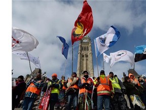 A group of First Nations adults and youth finish a spiritual journey from Attawapiskat First Nation to Parliament Hill in Ottawa on Monday, February 24, 2014. The twenty-five Indigenous walkers traveled 1700km with concerns about broken treaties, land and water protection, and, human rights issues.
Photograph by: Sean Kilpatrick ,