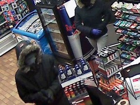 Images of a man and a woman robbing Fay Mart Convenience in the 3300 block of Howard Avenue were released by Windsor Police.