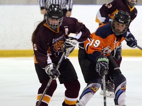 Sandwich's Kennedy Snivley, right, keeps and eye on Leamington's Shannon Fehr at the Vollmer Centre in LaSalle Monday. (TYLER BROWNBRIDGE/The Windsor Star)