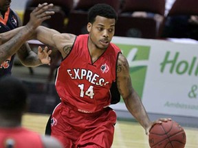 Windsor Express Gary Gibson, right, shakes off contact by Island Storm Brandon Robinson in first quarter NBL Canada basketball action from WFCU Centre Thursday November 13, 2014. (NICK BRANCACCIO/The Windsor Star)