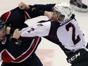 Windsor's Patrick Sanvido, right, fights Saginaw's Nick Moutrey at the WFCU Centre. (TYLER BROWNBRIDGE/The Windsor Star)