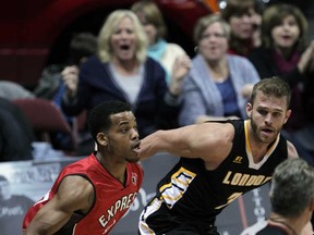 Windsor Express Gary Gibson looks for room against Zane Johnson of London Lightning in NBL Canada league action from WFCU Centre Wednesday November 19, 2014. (NICK BRANCACCIO/The Windsor Star)