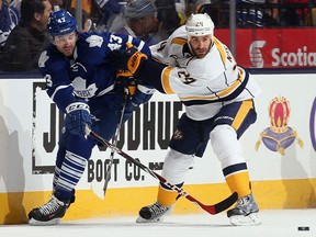 Nashville's Eric Nystrom, right, checks Toronto's Nazem Kadri during the first period at the Air Canada Centre Tuesday. (Photo by Bruce Bennett/Getty Images)