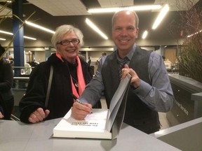 Craig Pearson signs a copy of From The Vault for his mom Anne.