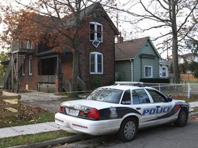 Firefighters investigate an overnight fire at a duplex at 665 Assumption Street on Nov. 3, 2014.