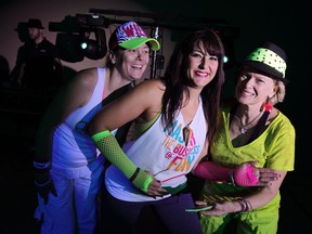Jodie Komsic, left, Nancy Byrne and Anne Haas were up and active during Zumba Glow fundraiser for Transition to Betterness and Project Cuddle at the Giovanni Caboto Club of Windsor November 21, 2014. Bryne is a licenced Zumba instructor. (NICK BRANCACCIO/The Windsor Star)