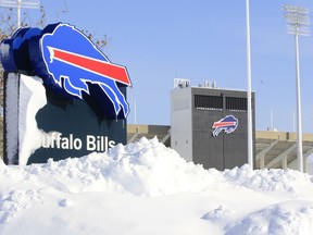 Snow covers a sign at Ralph Wilson Stadium,  home of the Buffalo Bills in Orchard Park, N.Y. (AP Photo/The Buffalo News, Harry Scull Jr.)