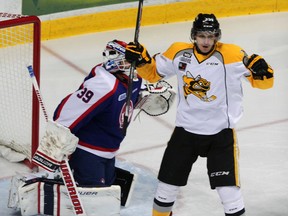 Sarnia's Nikita Korostelev, right, celebratres Sarnia's first goal against Windsor goalie Alex Fotinos in the first period at the WFCU Centre. (NICK BRANCACCIO/The Windsor Star)