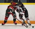 Windsor's leading scorer Savannah Bouzide, right, is checked by London's Grace Donaldson during their Provincial Women's Hockey League game at Forest Glade Arena. (DAN JANISSE/The Windsor Star)