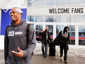 Buffalo running back Fred Jackson, left, leaves the field house with his teammates and prepares to board a bus Friday in Orchard Park, N.Y. (AP Photo/Gary Wiepert)