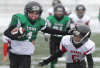 Titans’ Nathan Smith, left, powers his way past the Giants’ Anthony Elam during the tyke division final at Alumni Field Saturday. (DAN JANISSE/The Windsor Star)