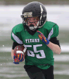 The Titans’ Liam Carlone carries the football during the Day of Champions at Alumni Field Saturday. (DAN JANISSE/The Windsor Star)