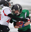 The Titans’ Liam Carlone, right, is tackled by the Giants’ Aaron Thwaites in the tyke division final at Alumni Field. (DAN JANISSE/The Windsor Star)