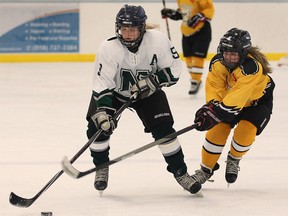 Belle River's Katherine Carter, left, is checked by Amherst's Carley Renaud at the Atlas Tube Centre in Lakeshore Tuesday. (DAN JANISSE/The Windsor Star)