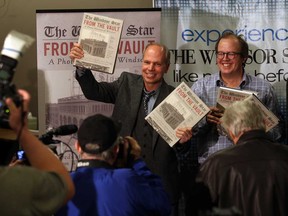 Authors Craig Pearson, left, and Dan Wells, with a gathering of media and visitors during FROM THE VAULT, A Photo History of Windsor in the newroom of The Windsor Star, November 28, 2014. (NICK BRANCACCIO/The Windsor Star)