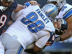 Chicago quarterback Jay Cutler, right, is tackled by Detroit's Nick Fairley at Soldier Field. (Photo by Jonathan Daniel/Getty Images)