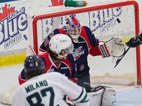 Plymouth's Sonny Milano, left, scores a goal on Windsor goalie Alex Fotinos at Compuware Arena Wednesday. (RENA LAVERTY/Plymouth Whalers)