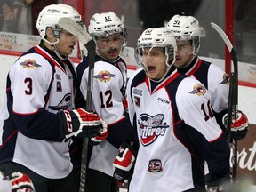 Windsor Spitfires Liam Murray, left, Jamie Lewis, Markus Soberg celebrate with goalscorer Aaron Luchjuk, behind right, in the first period against the Plymouth Whalers in OHL action at the WFCU Centre Friday November 28, 2014. (NICK BRANCACCIO/The Windsor Star)