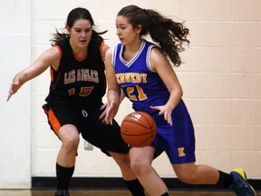L'Essor's Emilie Bondy, left, guards Kennedy's Toni Grujic in high school girls basketball playoff action at Kennedy Monday. (TYLER BROWNBRIDGE/The Windsor Star)